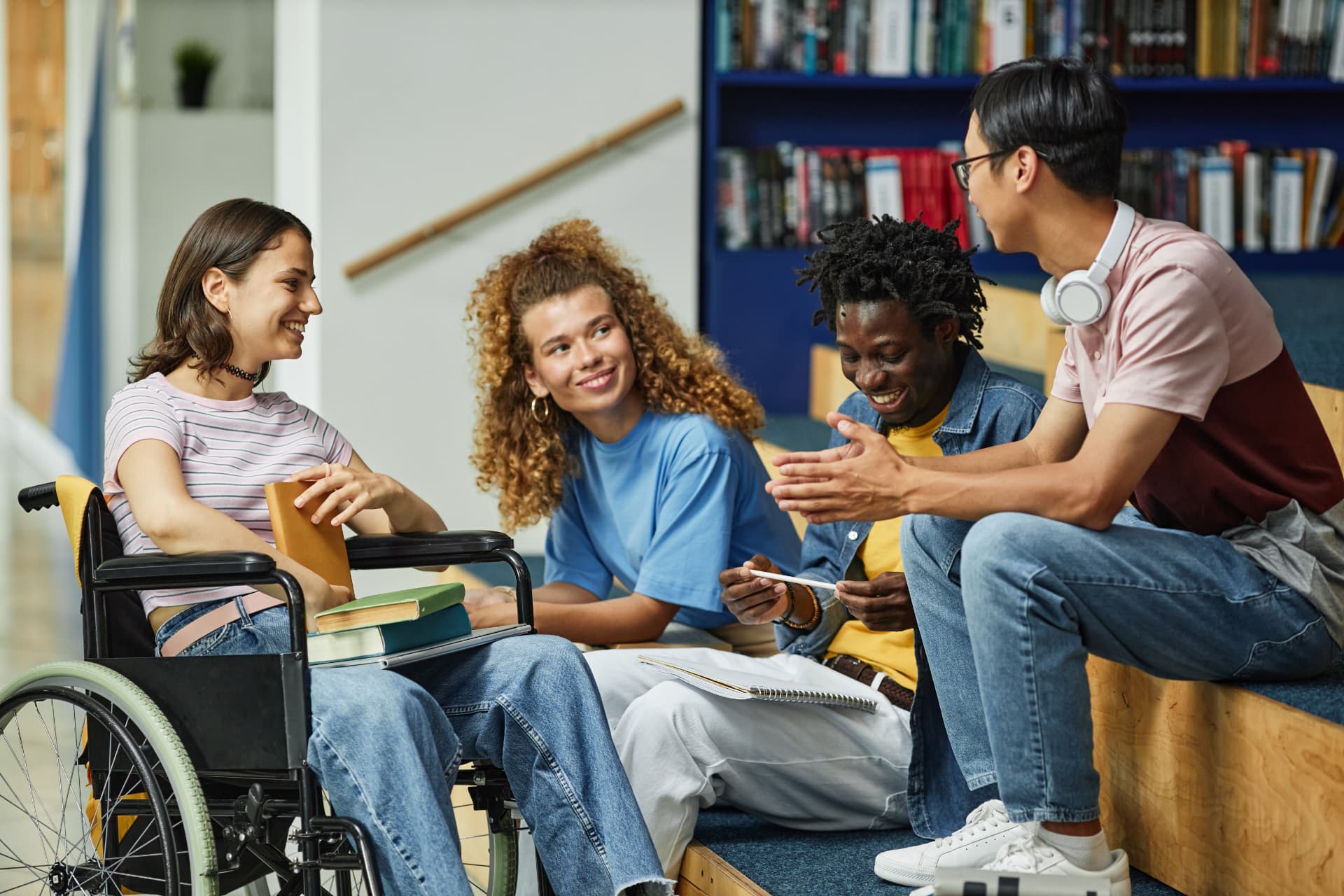 A diverse group of students sharing ideas in a library