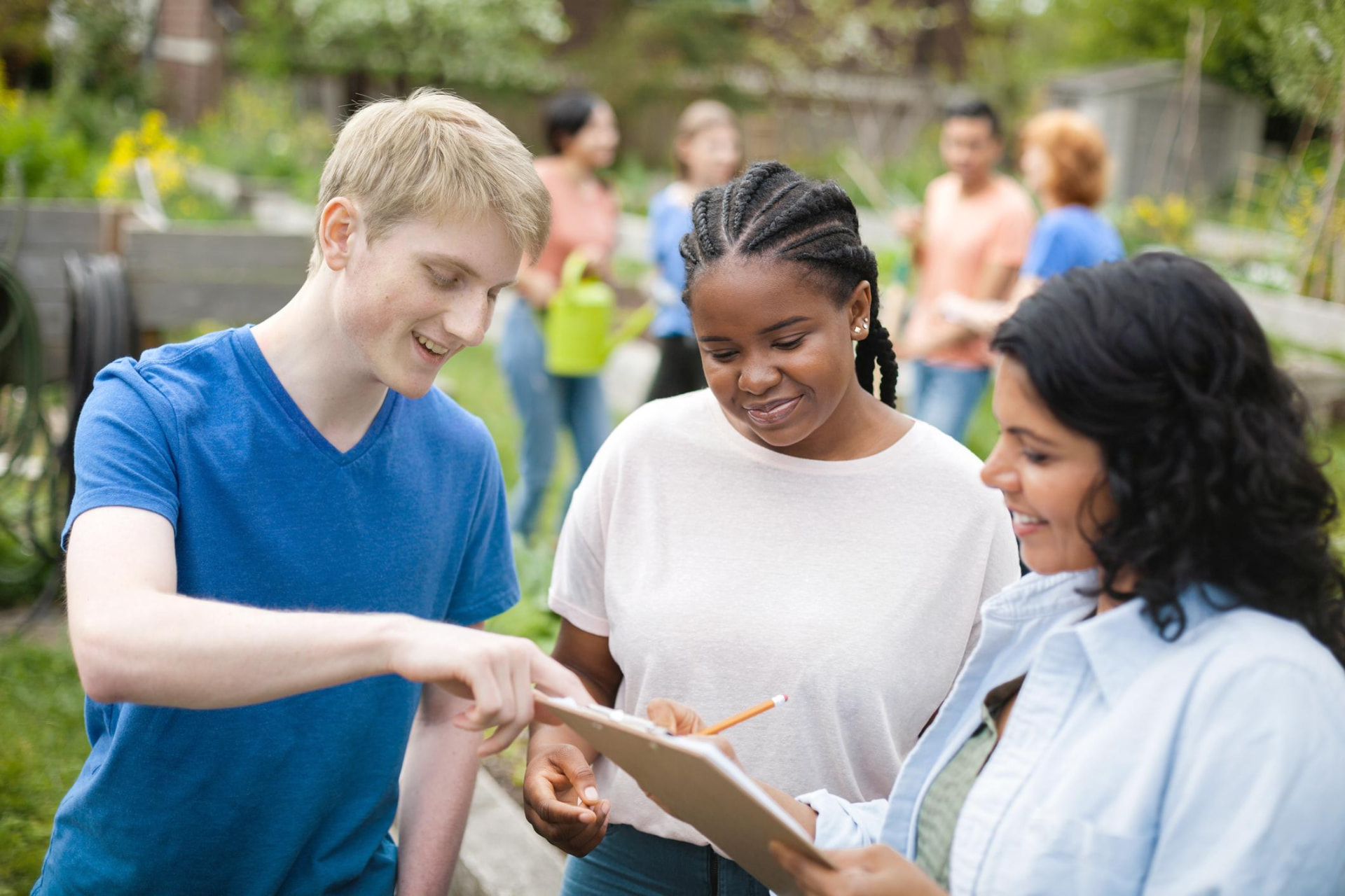 Young people collaborating on a community project outdoors